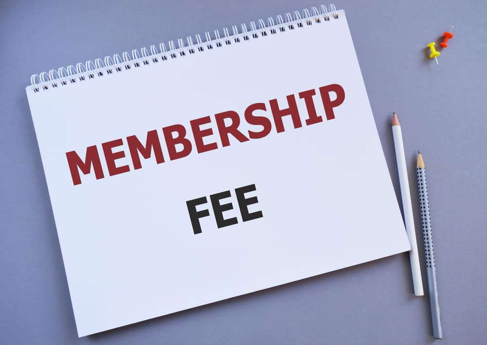 MEMBERSHIP FEE message written in Notebook