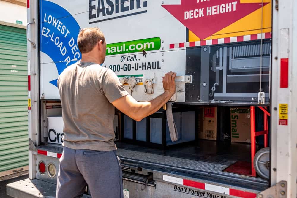 closing door of U-haul cargo truck trailer vehicle